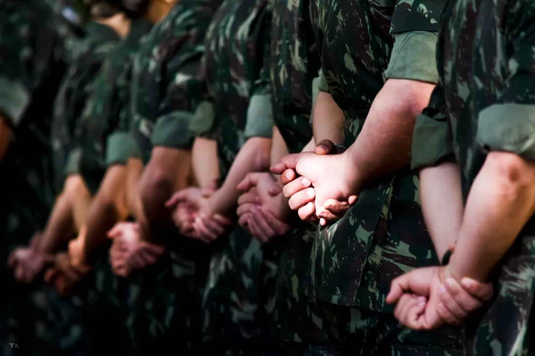 low-section-people-walking-field