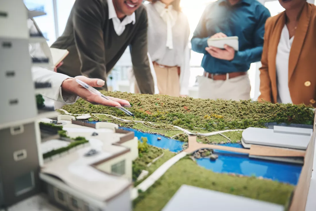 creative-people-hands-real-estate-with-3d-model-building-design-architecture-property-office-closeup-group-architect-team-meeting-project-planning-floor-layout-workplace