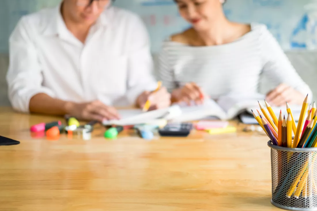 midsection-people-studying-table