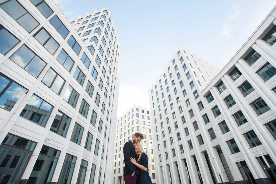 man-woman-hugging-background-is-building-business-center